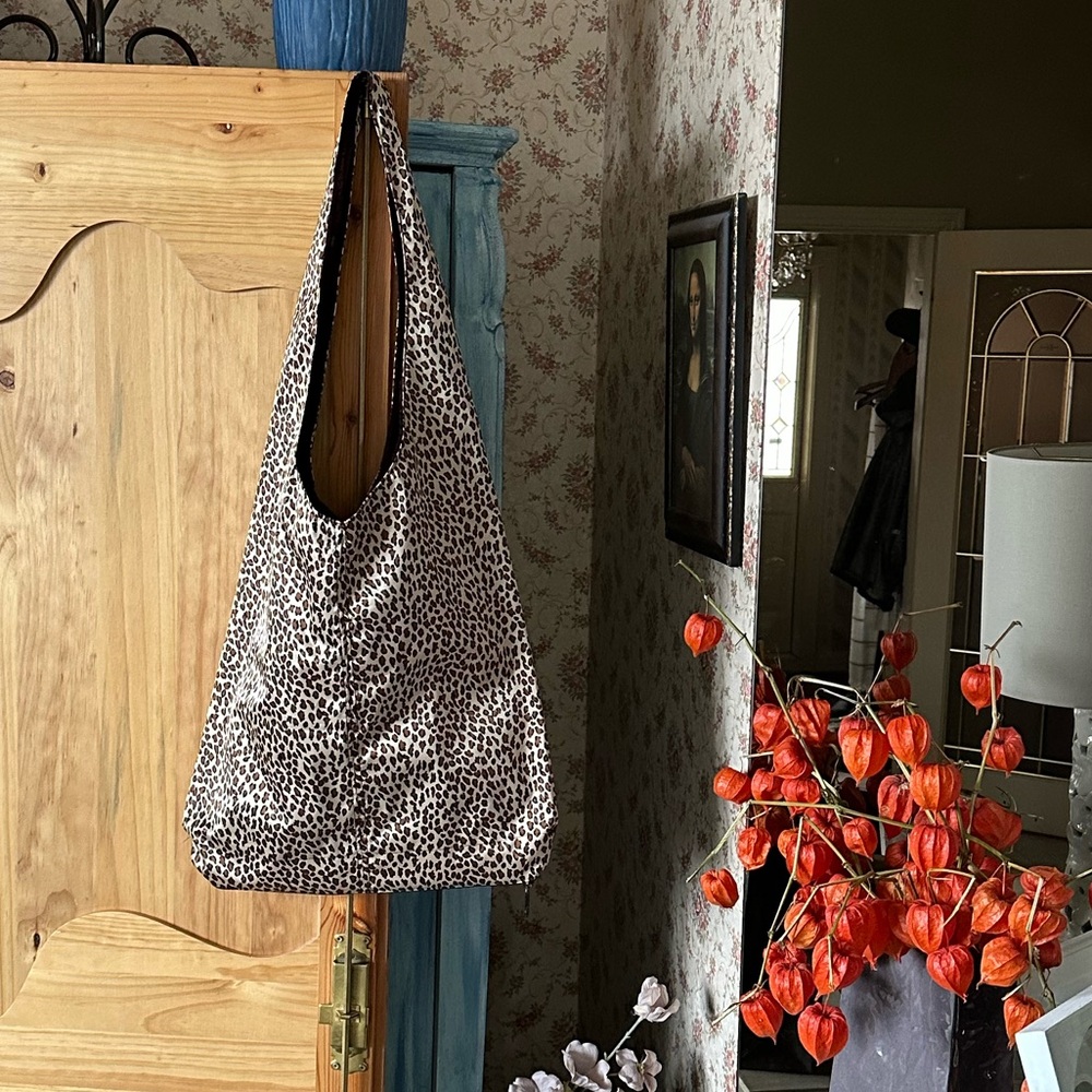 Leopard Print Hobo Tote Rain Bag with zipped bottom compartment.  $45